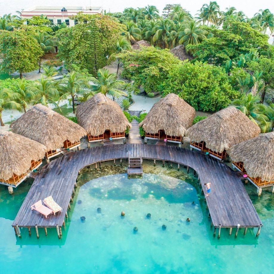 Over-the-water-cabanas-st-georges-caye-resort-belize-thatched-roof-bungalow